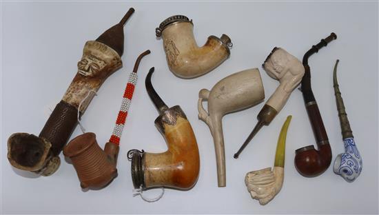 15 Meerschaum, clay, tribal and other pipes (a.f), a tambour pipe rack, a circular rack, glazed cigar case etc (Q)